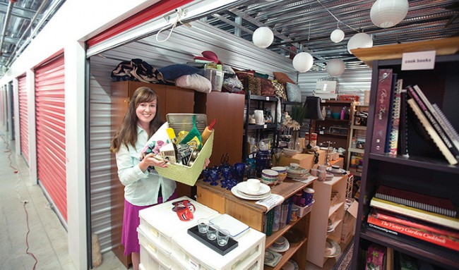 Anney Ardiel, shows off Anney's Closet, one of four locker storages full of donated items given free to women in need of household items to start up new homes and new lives.