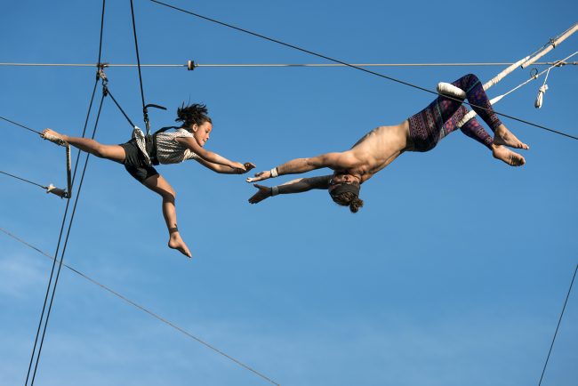 A young guest gets a lesson on flying trapeze at Club Med's “Creactive." © Mark Edward Harris
