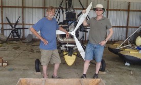 Bill Lishman and George Burden in front of one of Bill's ultralights