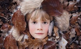 Child in leaves